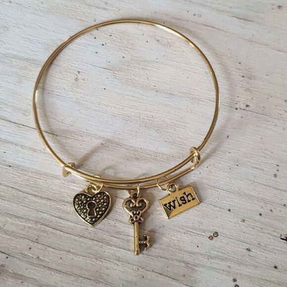 Bracelets by Sandra gold tone adjustable, wish - Picture 1 of 2